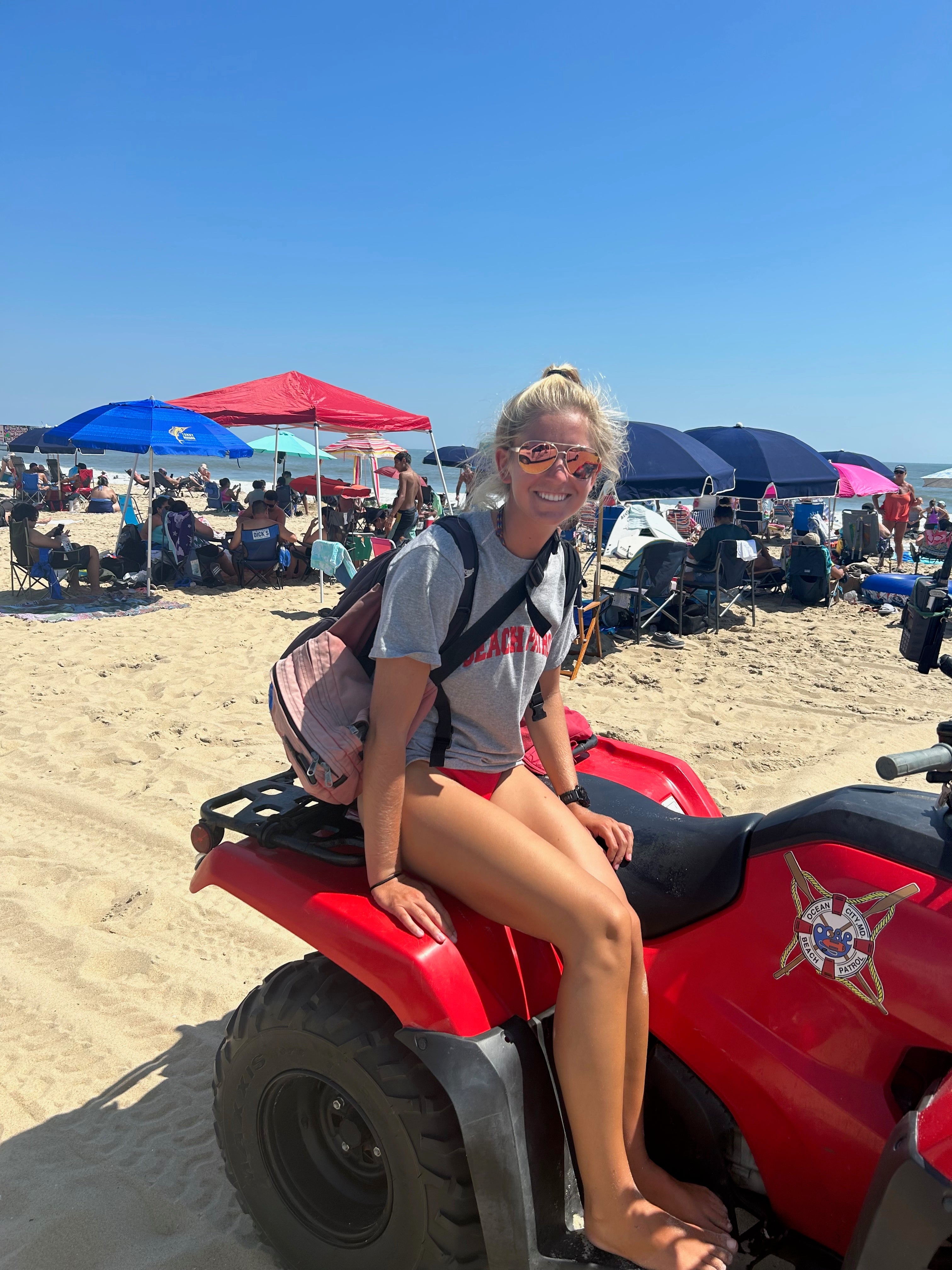 lifeguard wearing hook optics sitting on a quad